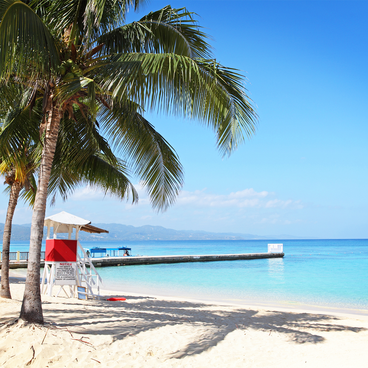 Pier and beach at Doctors Cave Beach in Jamaica redtag.ca Blog